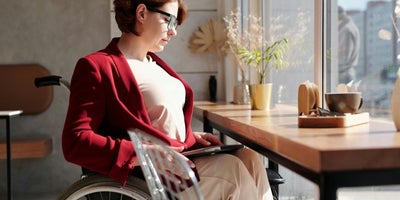 Women in wheelchair at desk